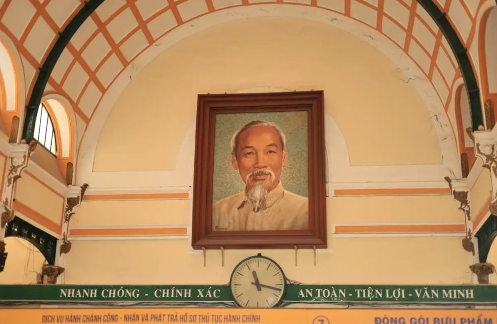 The large portrait of President Ho Chi Minh, displayed prominently in the central hall above the main counter